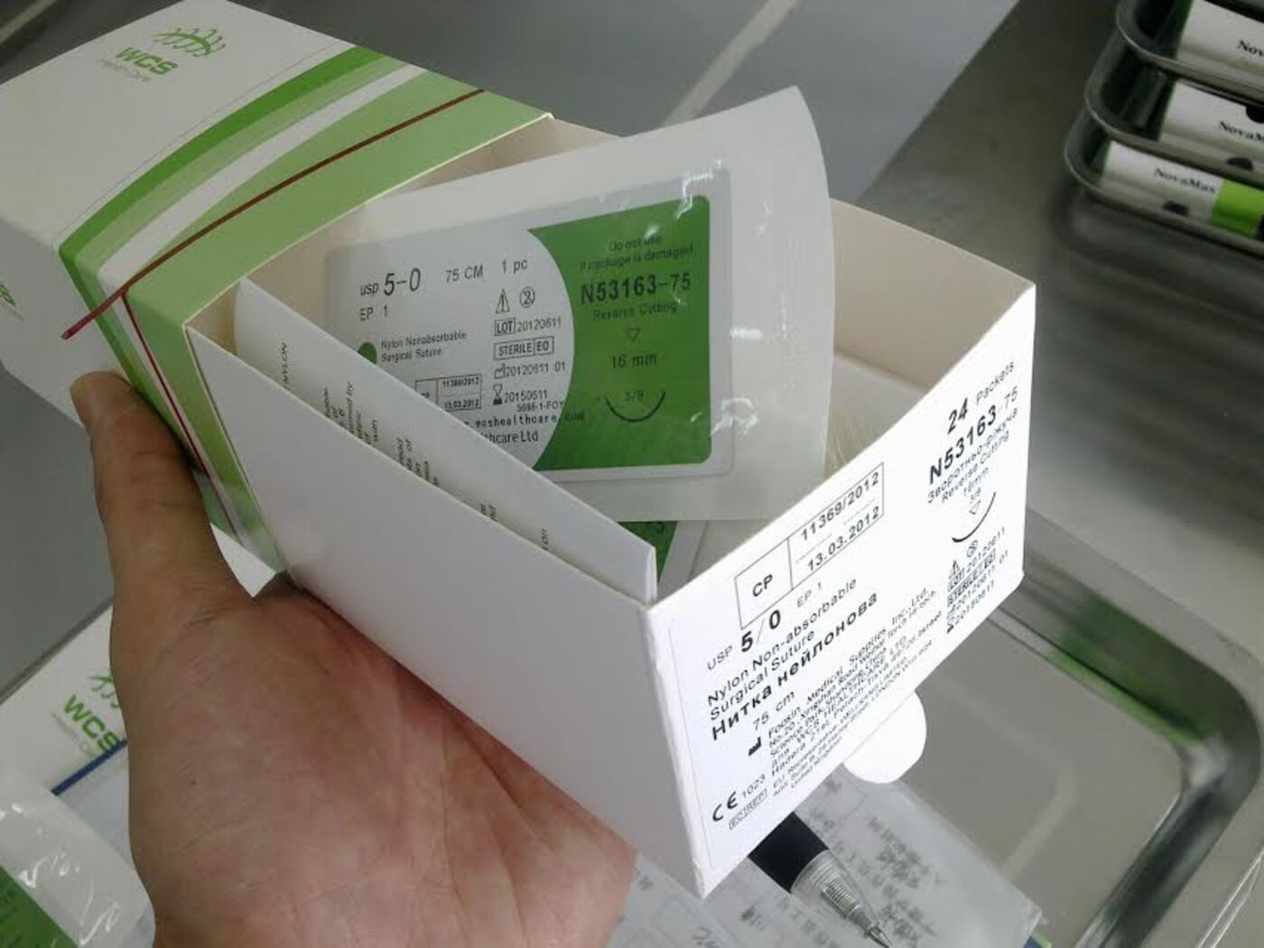 WCS-branded sterile nylon surgical suture packs in their retail carton